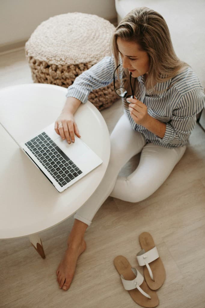 Person reviewing plans on a laptop at home